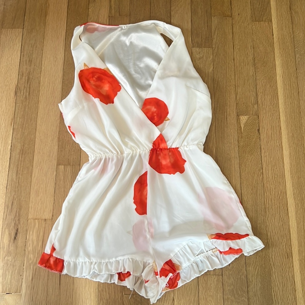 Creamy white romper with abstract rose pattern- size small (fits xs as well)